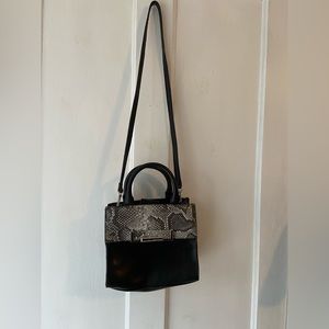 Black purse with faux snakeskin detail